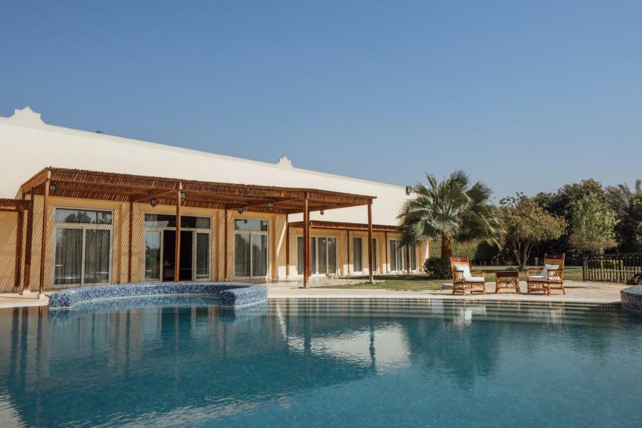 Jolie Ville Hotel & Spa Kings Island Luxor Bagian luar foto The resort's swimming pool