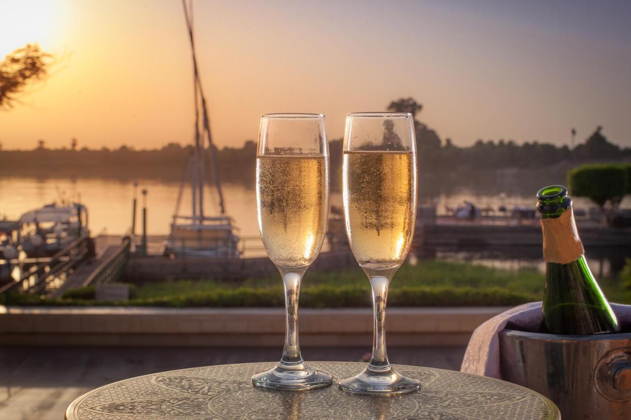 Jolie Ville Hotel & Spa Kings Island Luxor Bagian luar foto Two champagne flutes